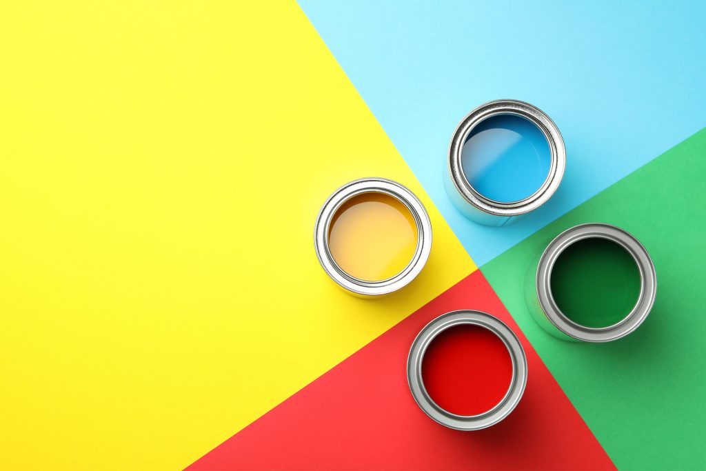 paint cans on top of colored background